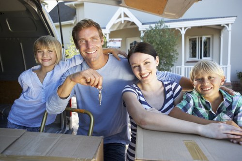 Professional movers loading furniture for a Westminster move